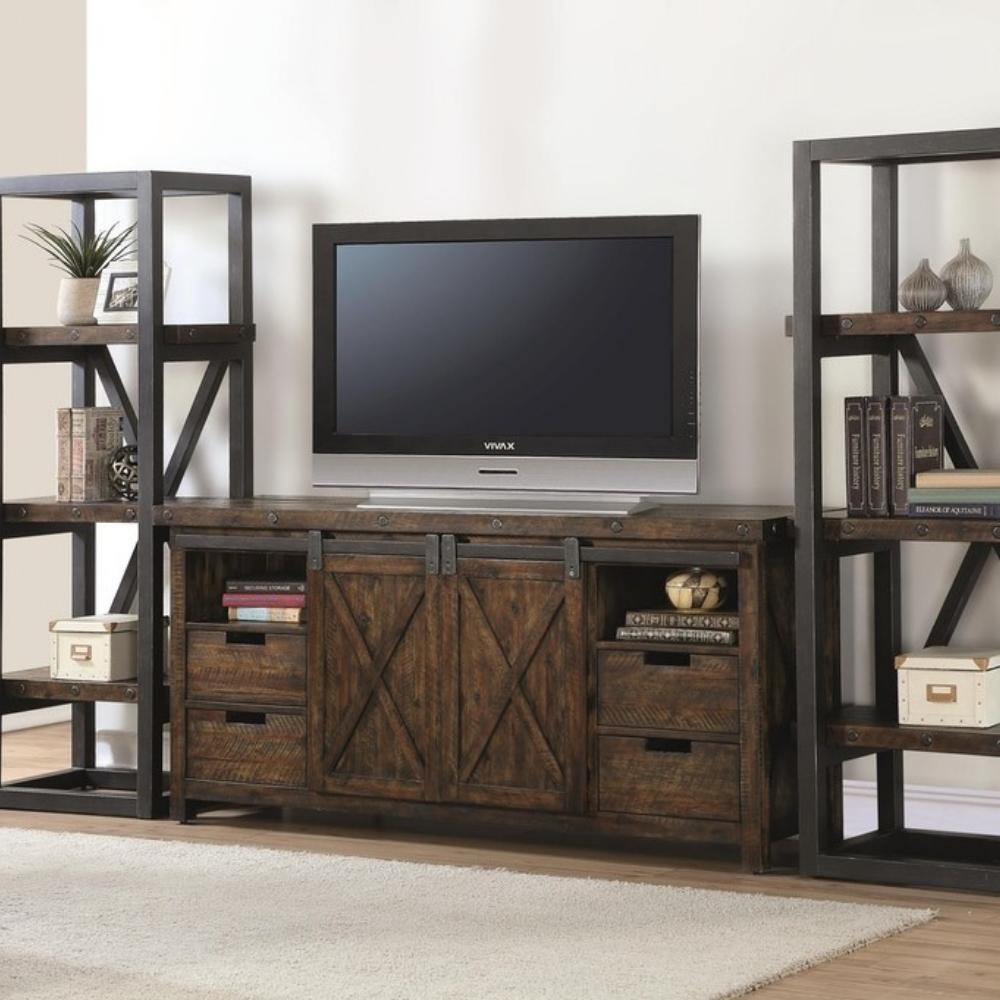 dark wood and metal farmhouse style media console with tv. Two open bookcases flank either side.