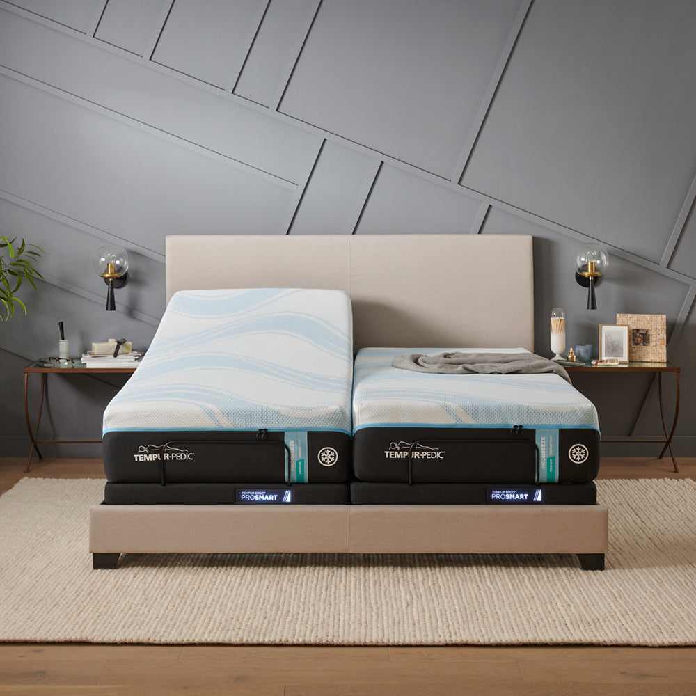 tempur-pedic mattresses on an adjustable power base and upholstered bed frame.