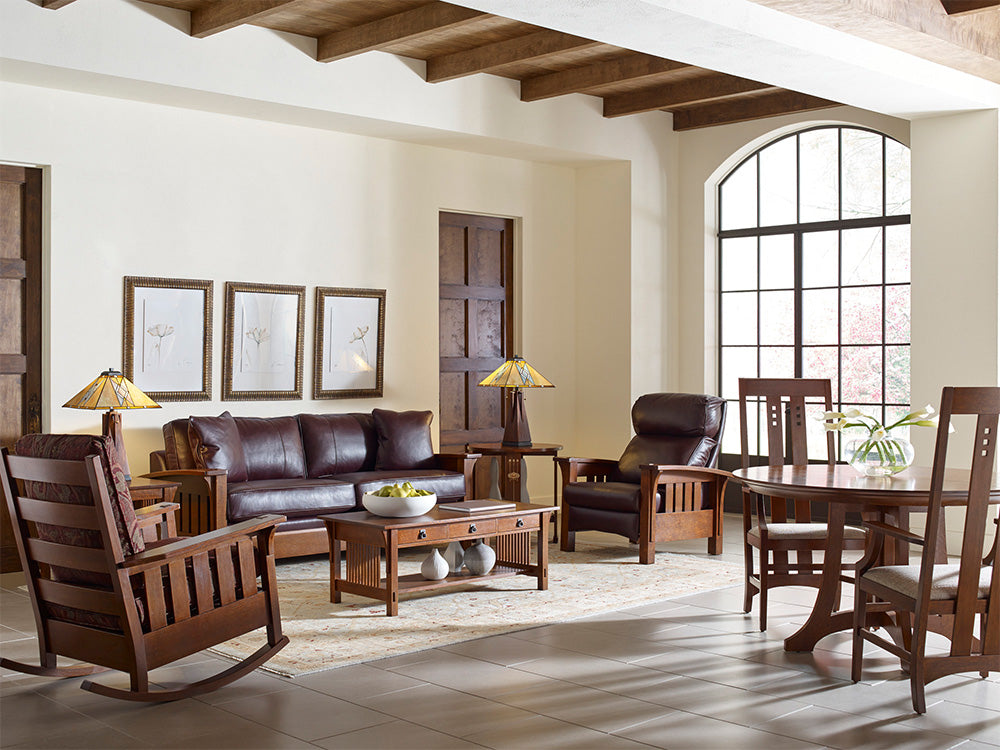 A living room scene featuring a sofa, recliner, and rocking chair from Stickley's Mission collection.