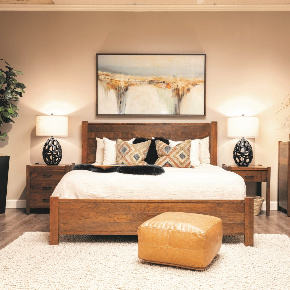 Dark wood bed from Seldens exclusive Baker collection on display at the Seldens Tacoma showroom.