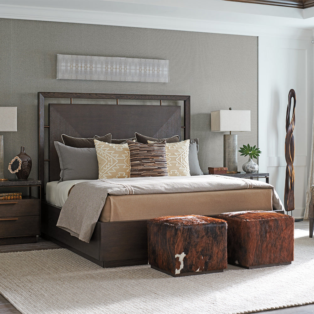 Modern dark wood bed in a bedroom with matching nightstands.