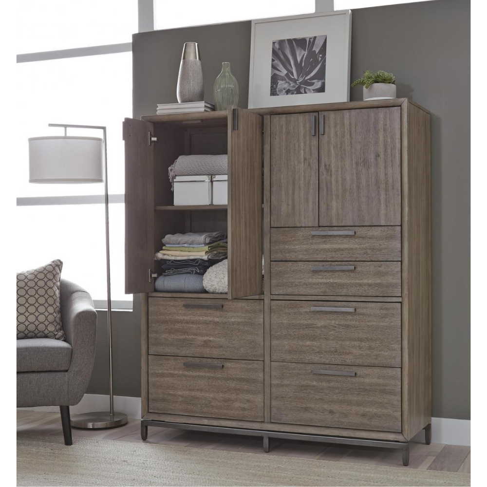 Grey-washed wood clothes cabinet next to gray fabric arm chair