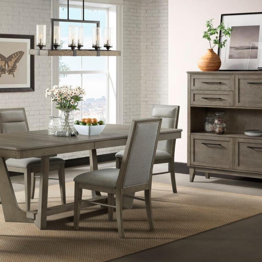 dining room scene with grey wood dining table, side chairs, and server cabinet.