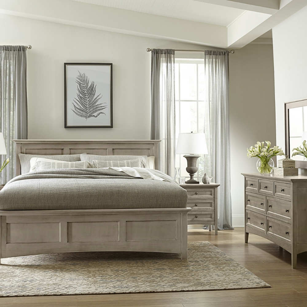 stickley revere bedroom scene with light grey wood bed, nightstands, dresser, and mirror