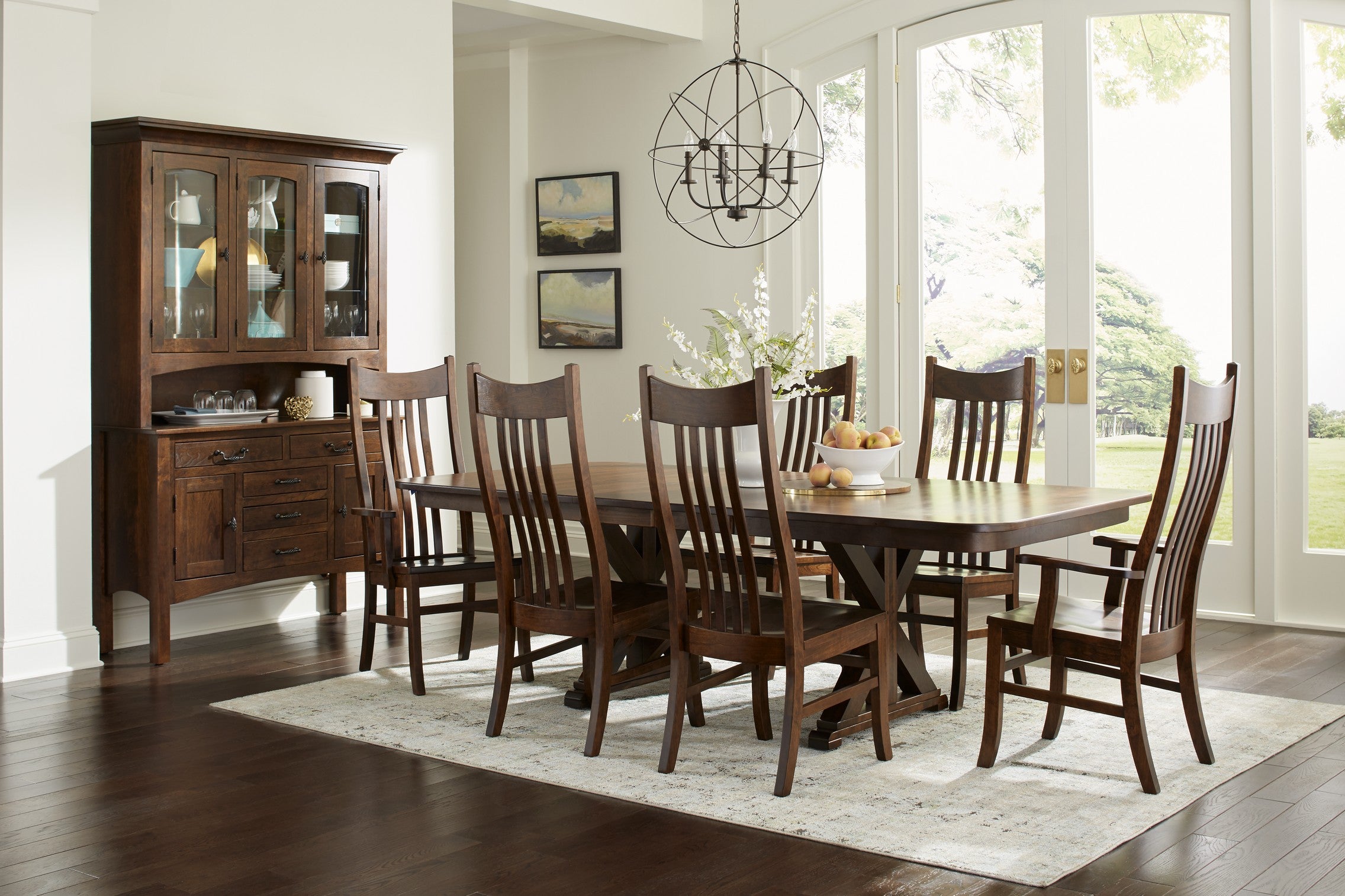Traditional dining room with a dark wood dining table surrounded by matching solid wood chairs