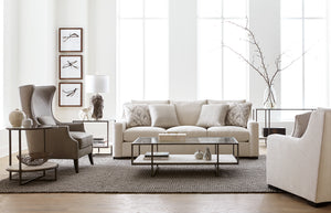 Living room scene featuring a sofa and chairs in neutral colors from Bernhardt furniture.
