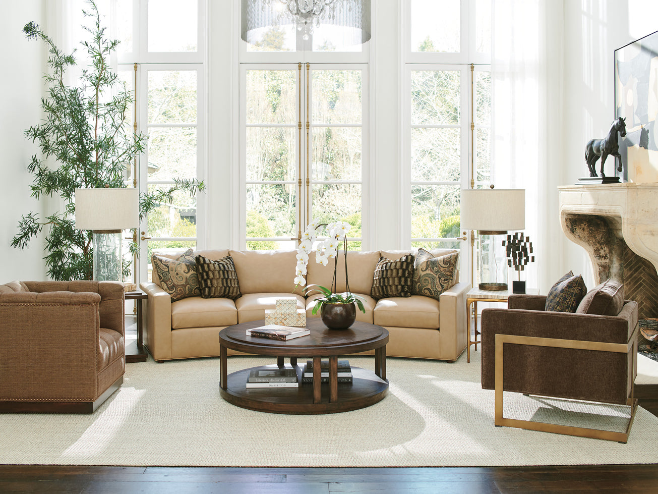 Living room scene from Lexington Furniture's Silverado collection featuring a large curved sectional sofa and a round cocktail table.