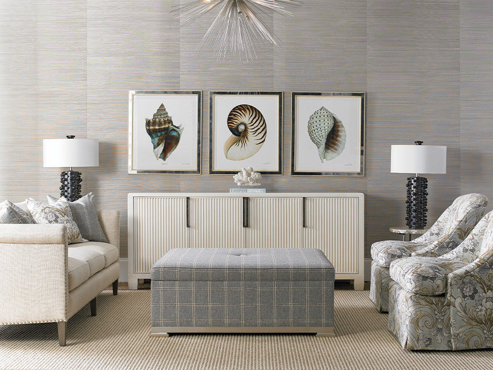 A classically styled coastal living room scene from Sherrill Furniture featuring a sofa, two chairs, and an upholstered ottoman.