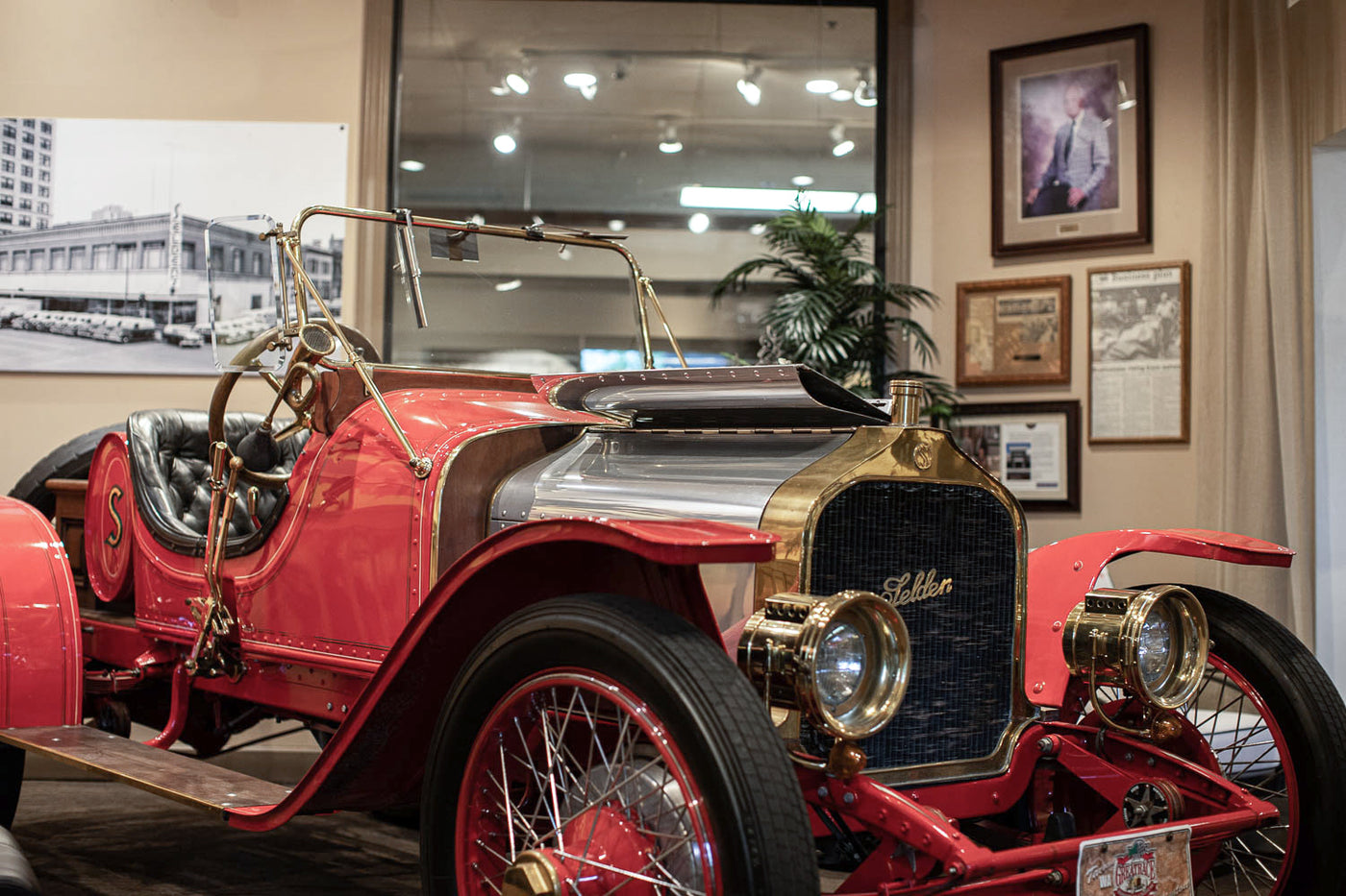 A vintage red vehicle parked inside the Seldens furniture showroom in Tacoma, Washington.