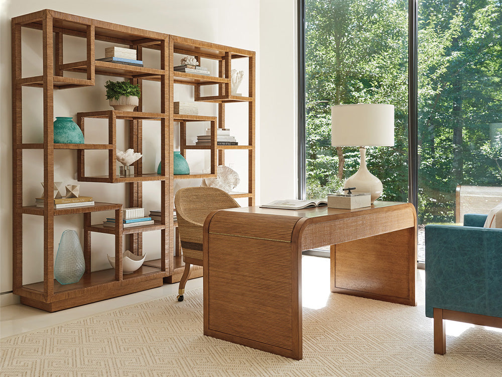 A rattan desk with matching chair and bookcases in an office scene from Tommy Bahama Home
