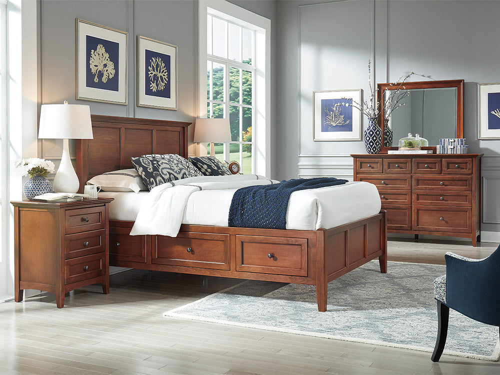 A traditional dark wood bedroom set from Whittier Wood featuring a storage bed, small nightstand and matching dresser.