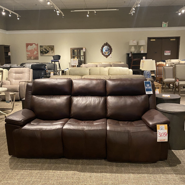 Seldens Sleep Gallery Remodel Clearance Sale room featuring a dark brown leather reclining sofa