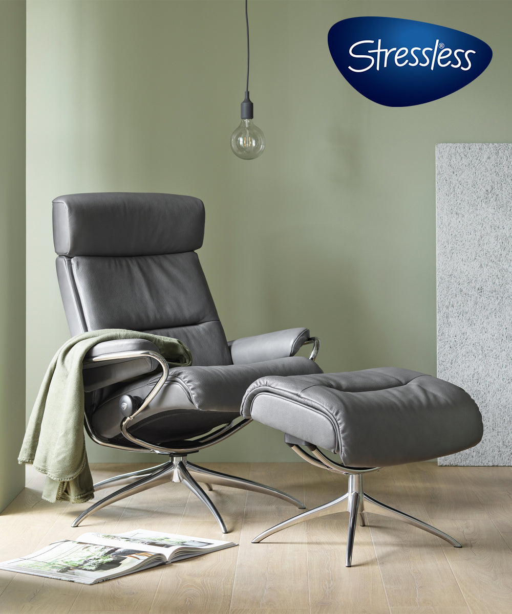 A modern gray leather chair and matching ottoman with the Stressless by Ekornes logo